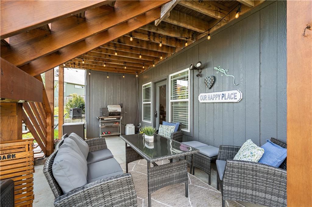 Covered patio under the deck of a walkout ranch home in Weston, MO