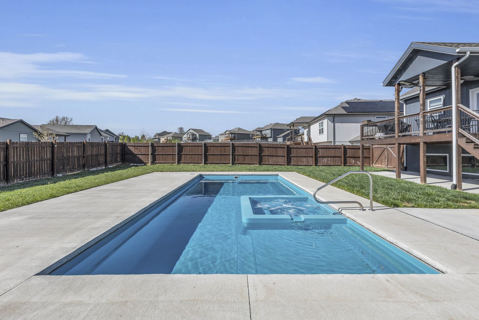 Inground heated and chilled saltwater pool in a Weston, Missouri backyard
