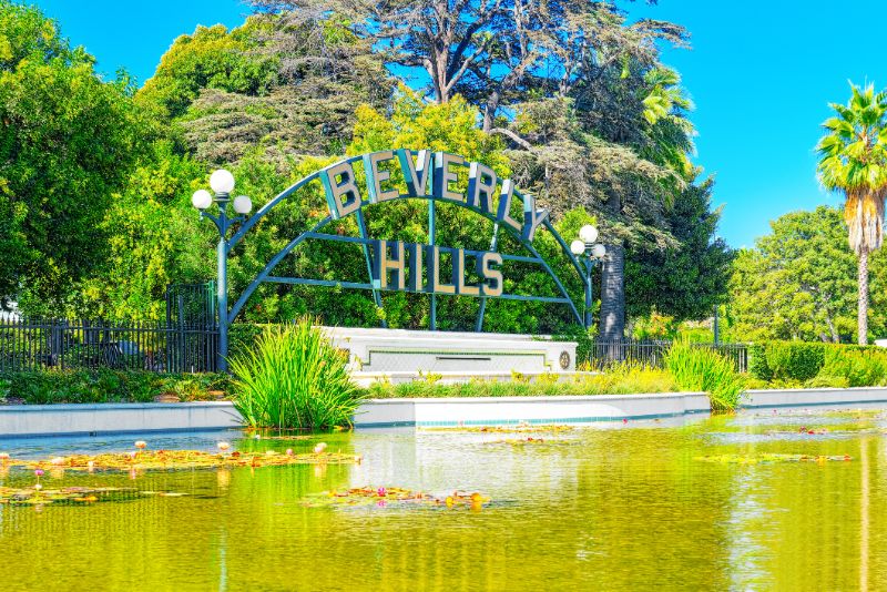 pond and the inscription beverly hills in the beverly gardens park