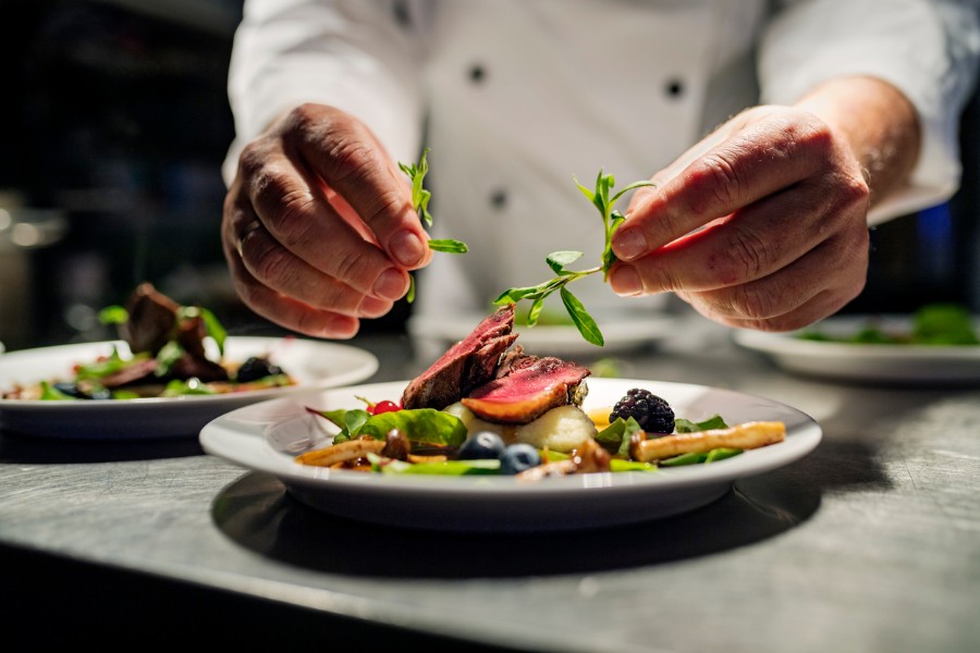 a chef plating a dish