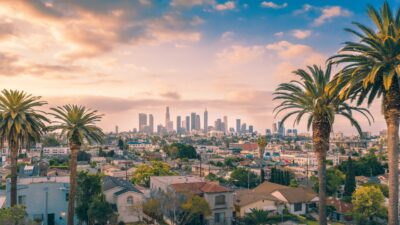 Beverly Hills neighborhoods guide with palm-lined luxury residential area in Los Angeles