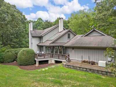 Luxury acreage property with creek-fed pond and mature woods