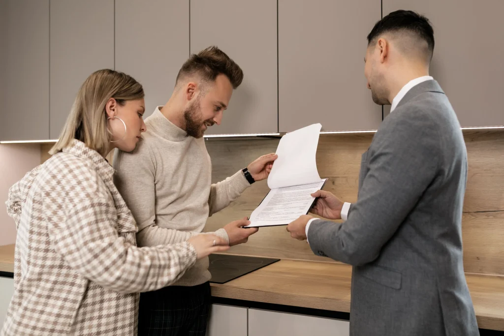 Couple Review Real Estate Documents given by Realtor