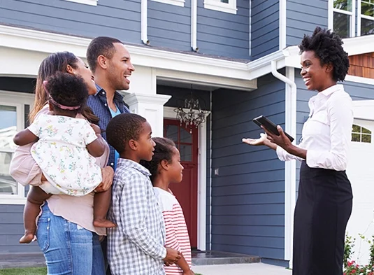 Real estate agent meeting family