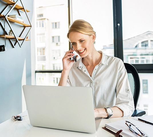 Real Estate Agent on phone in office