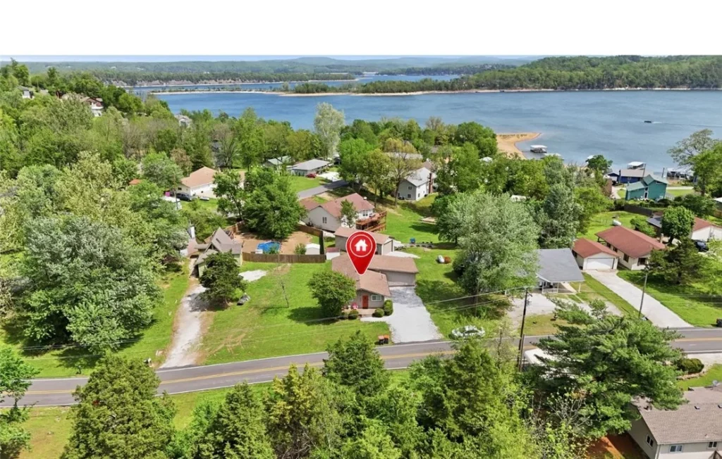 Ariel Shot of Northwest Arkansas neighborhood with red pin on selected house.