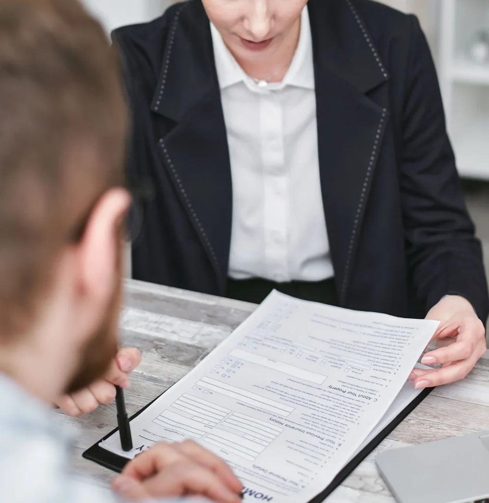 Mortgage Lender passing over paperwork