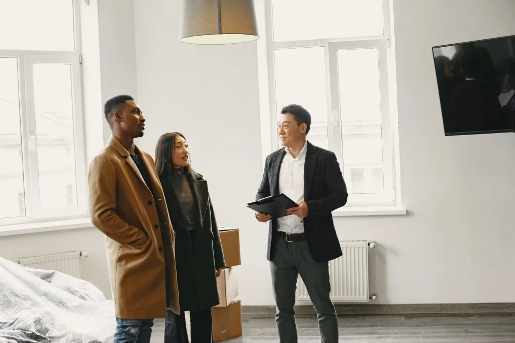 Real Estate Agent Meeting With Clients