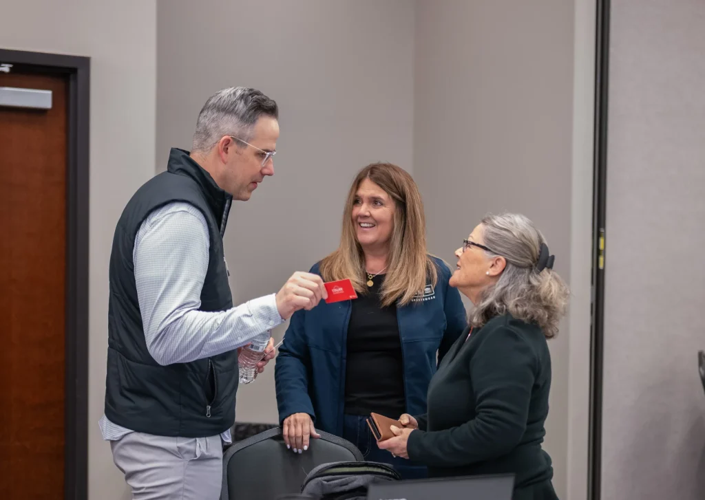 Agent Handing Card to Client