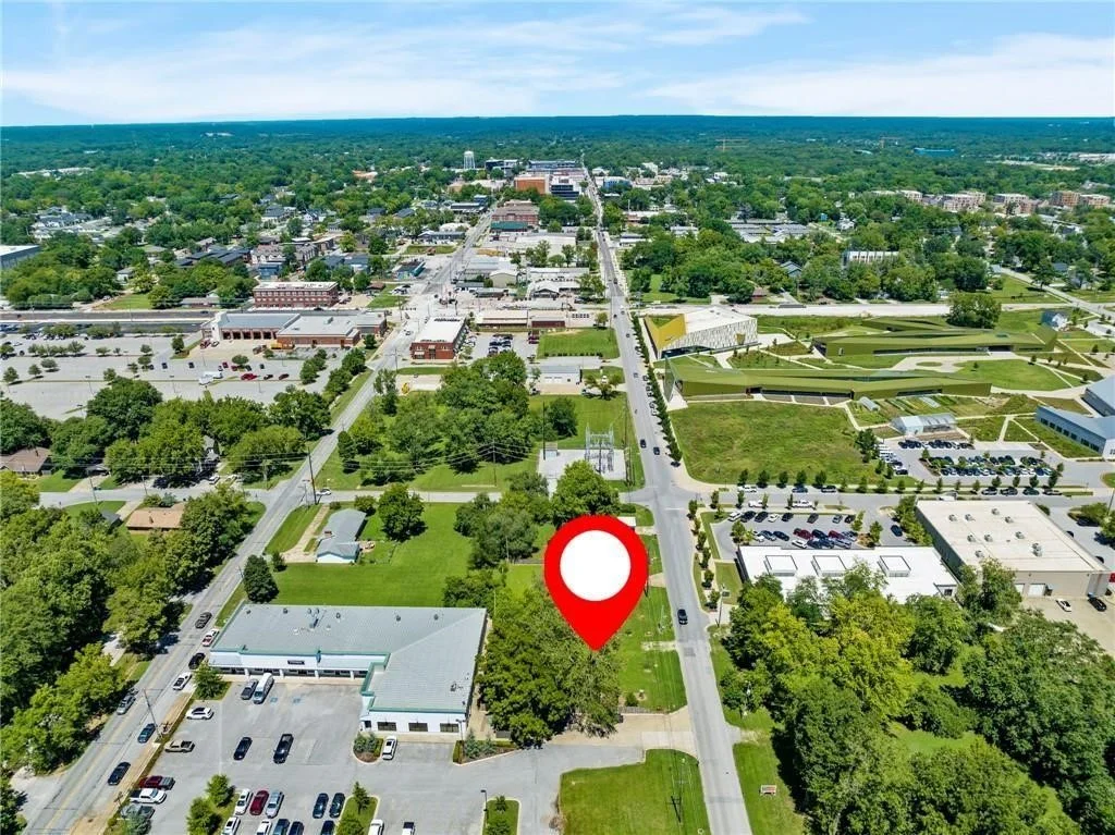 Ariel view of parcel of land, red map pin on the parcel