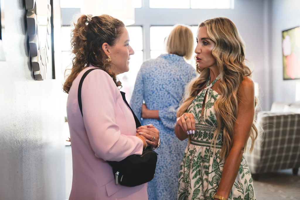 Collier and Associates real estate agent conversing