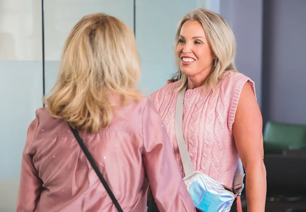 Real Estate Agents standing and conversing