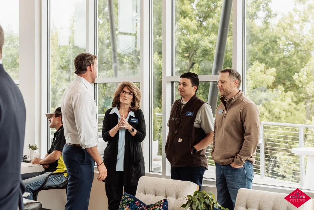 Real Estate Agents standing and negotiating