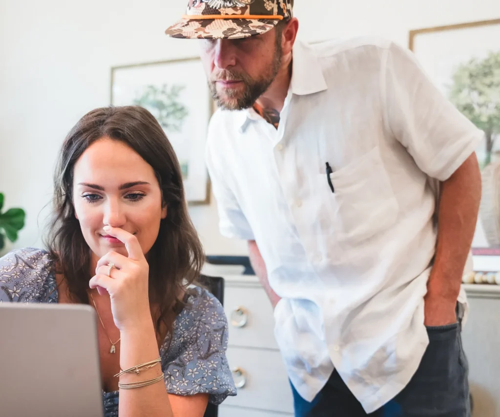 Real Estate Agents looking at a laptop for out of state relocators