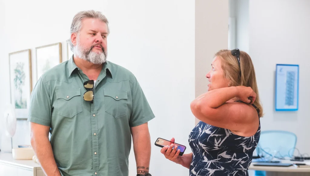 2 people standing and talking