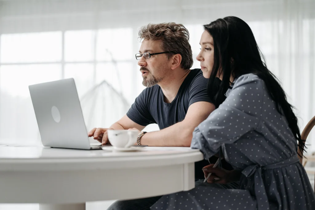 Couple looking at computer togeather
