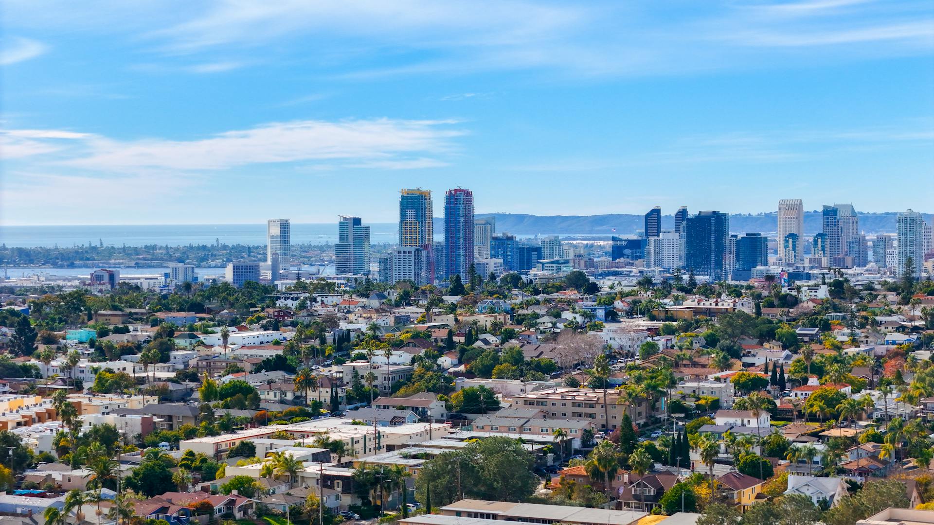 Aerial view of San Diego neighborhoods and coastline at sunset