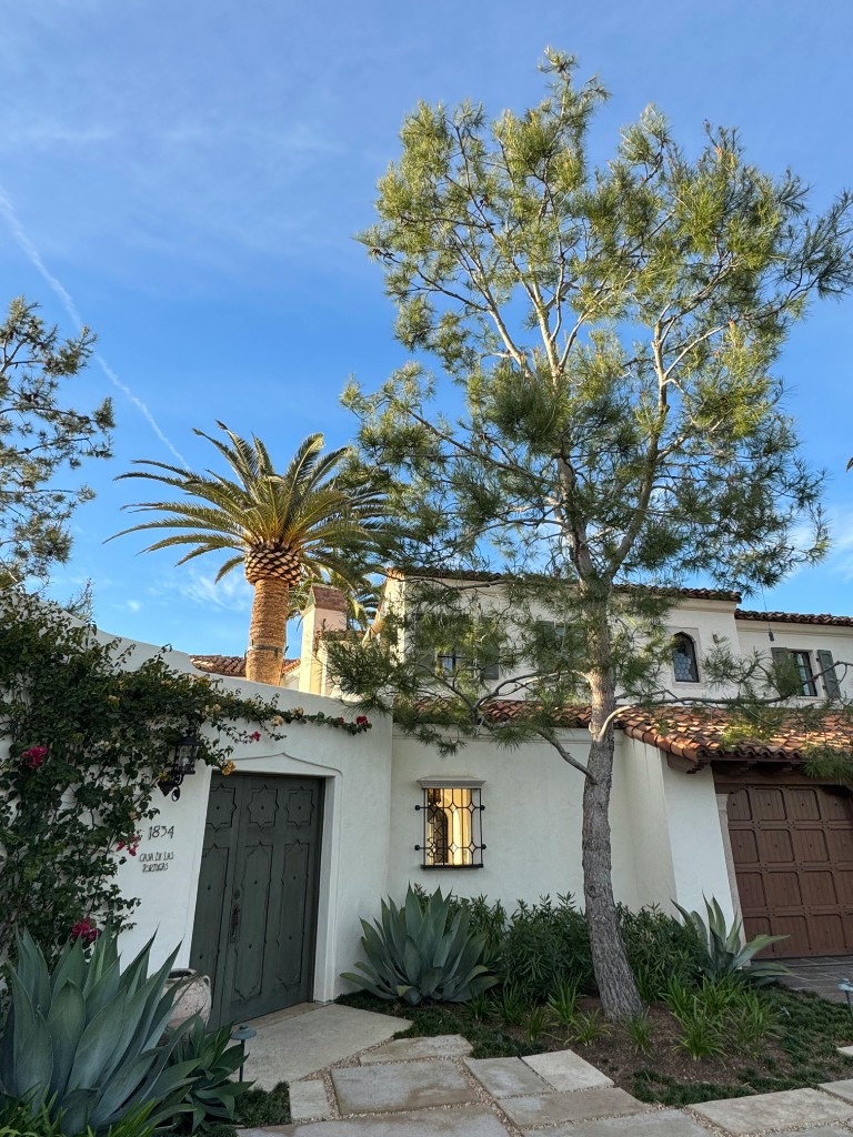 Spanish Colonial Revival home in Mission Hills San Diego with red tile roof and palm tree