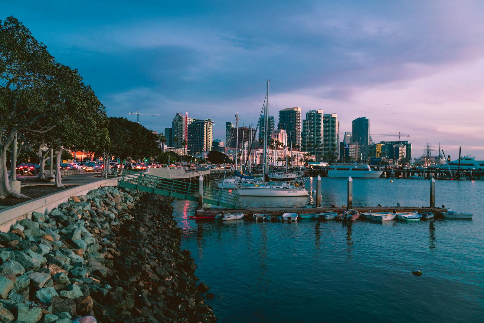 San Diego marina at golden hour, view of the city skyline from the harbor