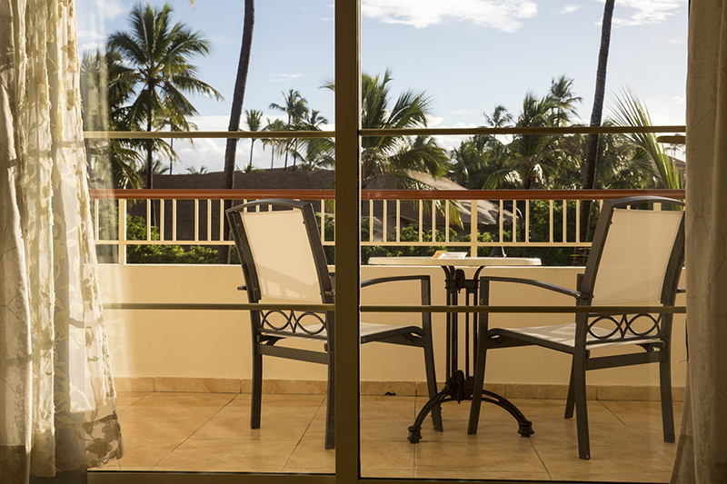 Wailea-Makena Vacation Rental balcony through the sliding glass door in the morning