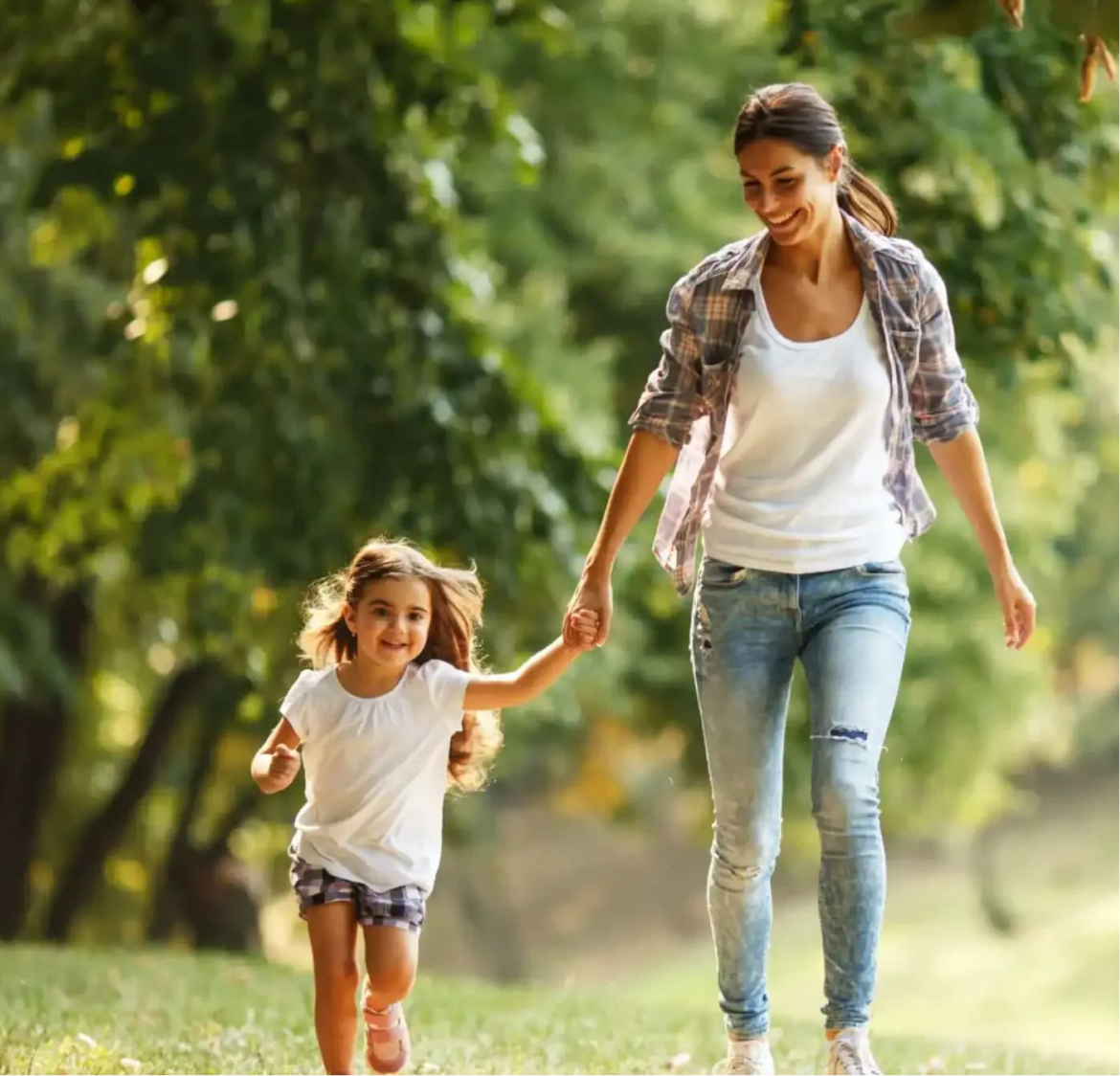 Mother and daughter walking outdoors