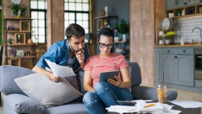 Couple-analyzing-the-home-and-expenses