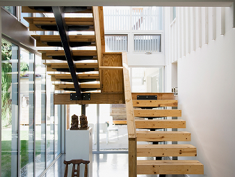 Interior with wooden staircase and glass walls