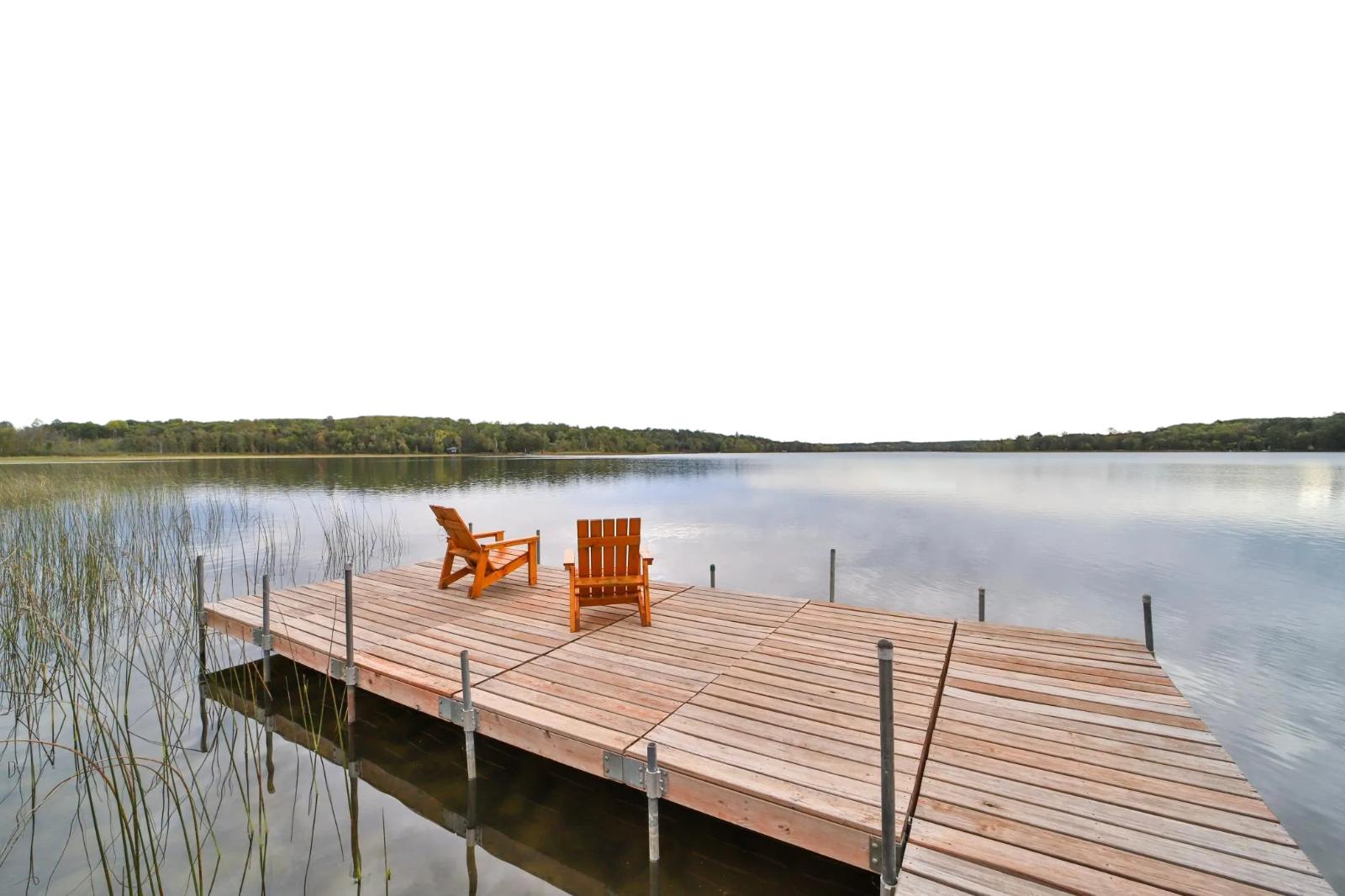 Lake view with dock and chairs