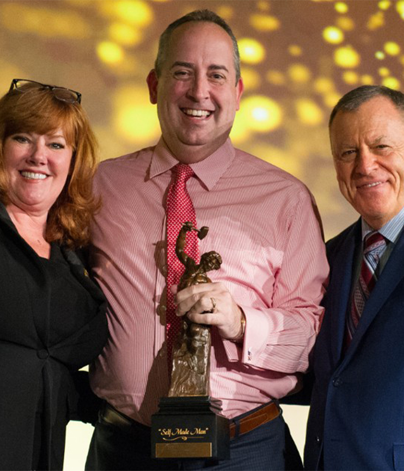 Chad Schwendeman Real Estate Group team with award