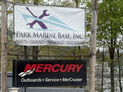Park Marine Base Marina sign in Northville NY featuring Mercury Marine service, storage, dockage, and boat repair services near the Great Sacandaga Lake.