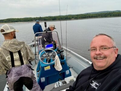 Group fishing from Aaron’s Guide Service boat on Great Sacandaga Lake in the Adirondacks.