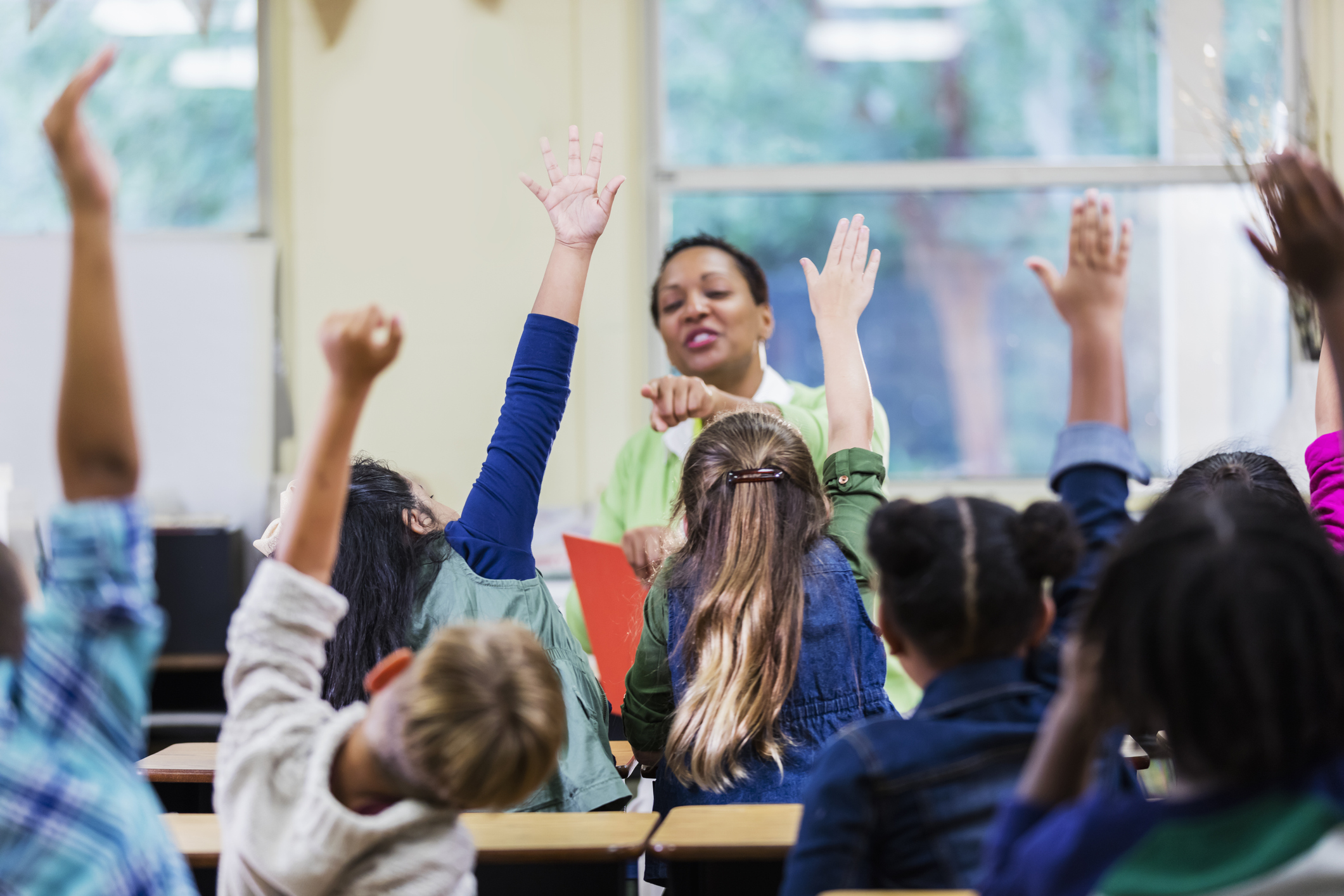 Teacher and students in elementary school classroom