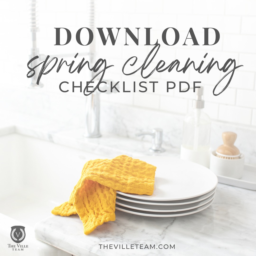 kitchen sink and counter with clean plates and dish rag; words download spring cleaning checklist pdf