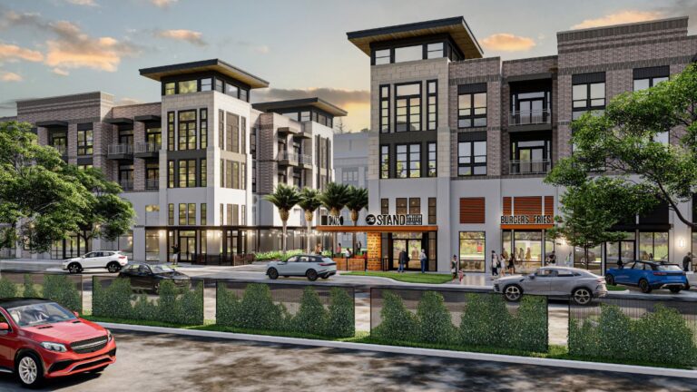 Modern mixed-use retail development with ground-floor storefronts and contemporary apartments above.