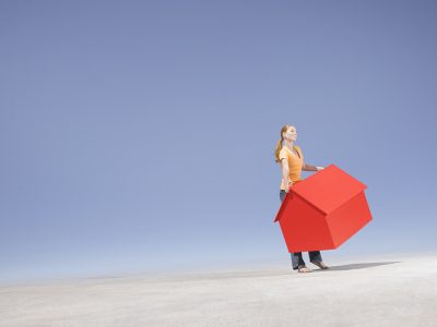 woman carrying a house