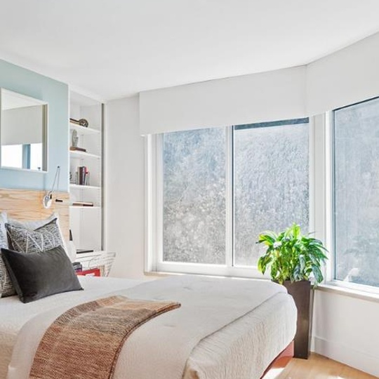 Bed with white bed cover