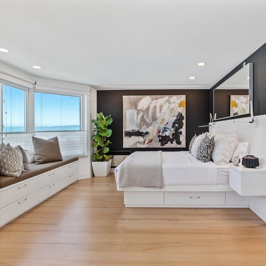 Bedroom with wood flooring
