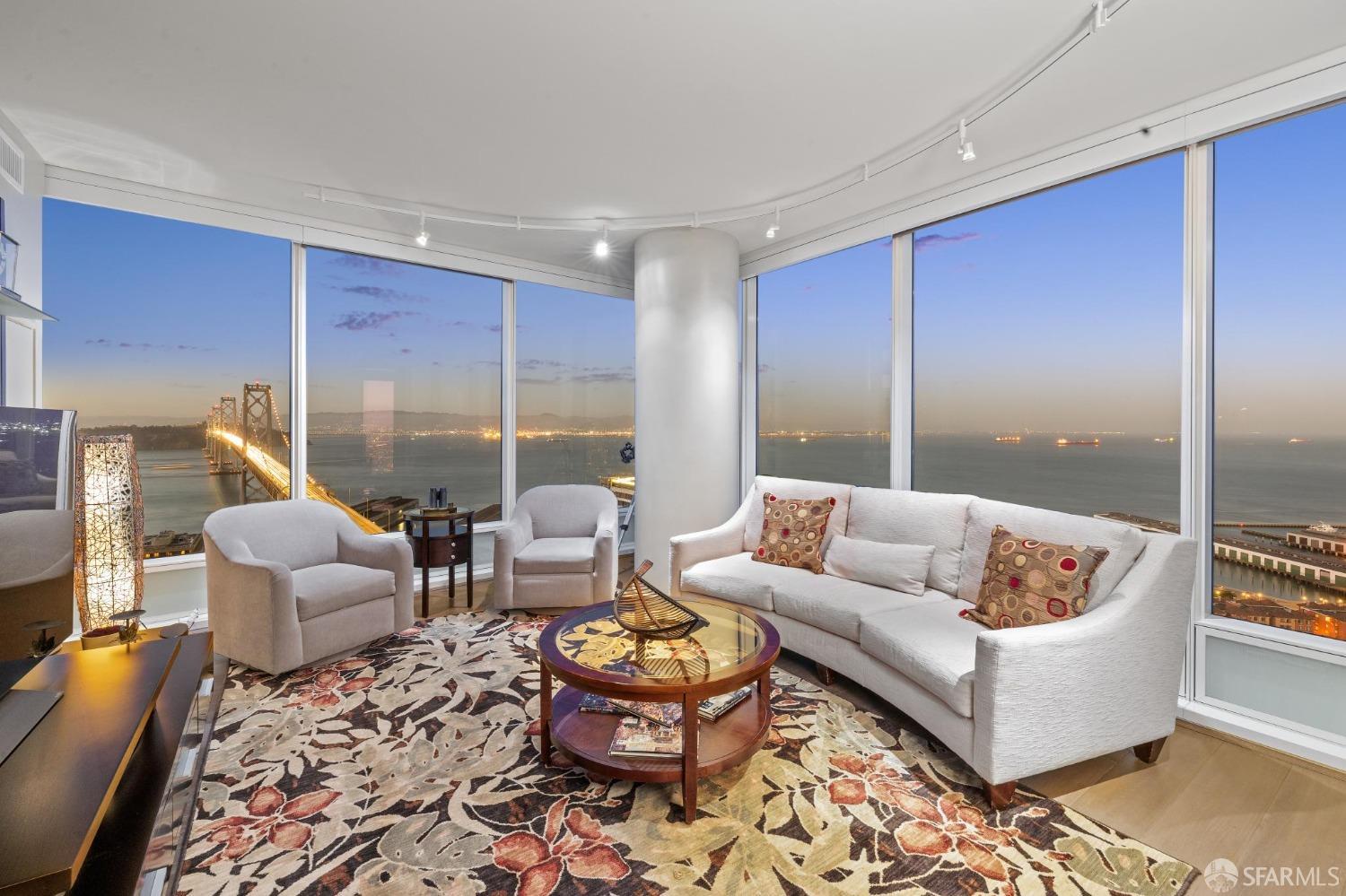 Living room in South Beach highrise condo with huge view of SF bay and bridge