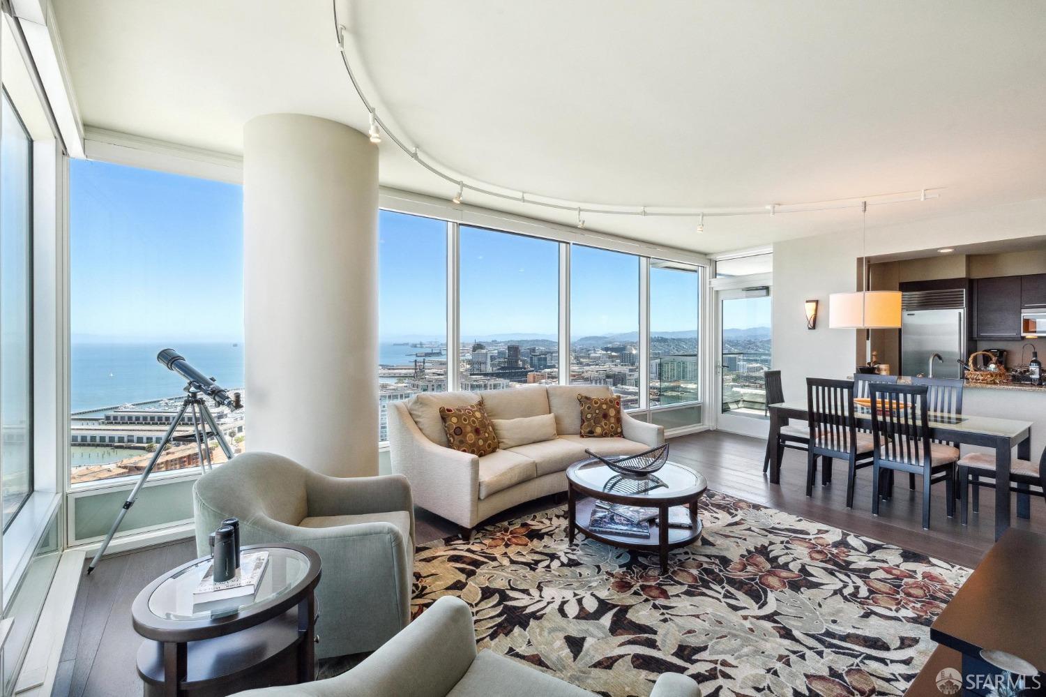 Condo dining area with telescope and panoramic views of South Beach