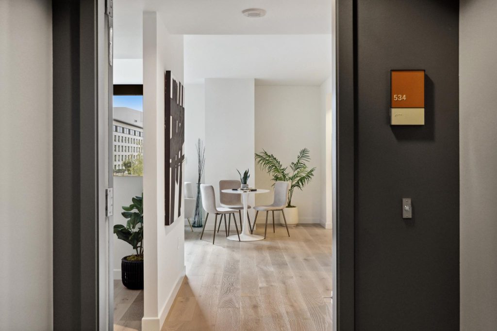 Front door opens to a white condo interior sold by top listing agent Robyn Kaufman for San Francisco real estate