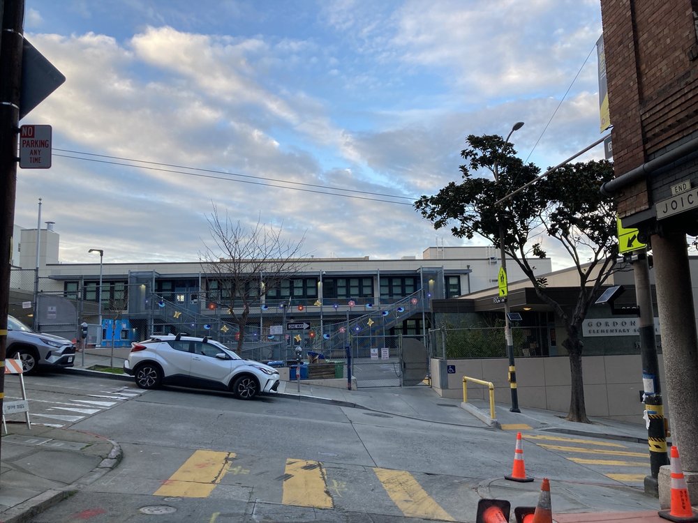 Exterior view of low brown building Gordon J Lau Elementary School