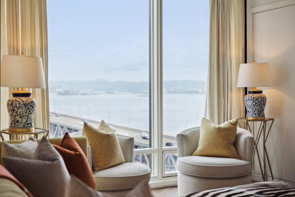 Close up of living area chairs and San Francisco bay views from a South Beach condo
