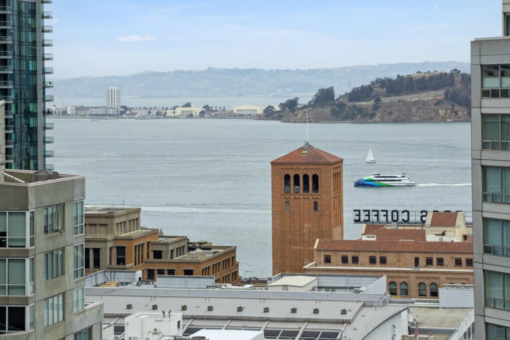 View over brick and modern buildings of San Francisco Bay from a sold South Beach condo by Robyn Kaufman and SFHIGHRISES.com