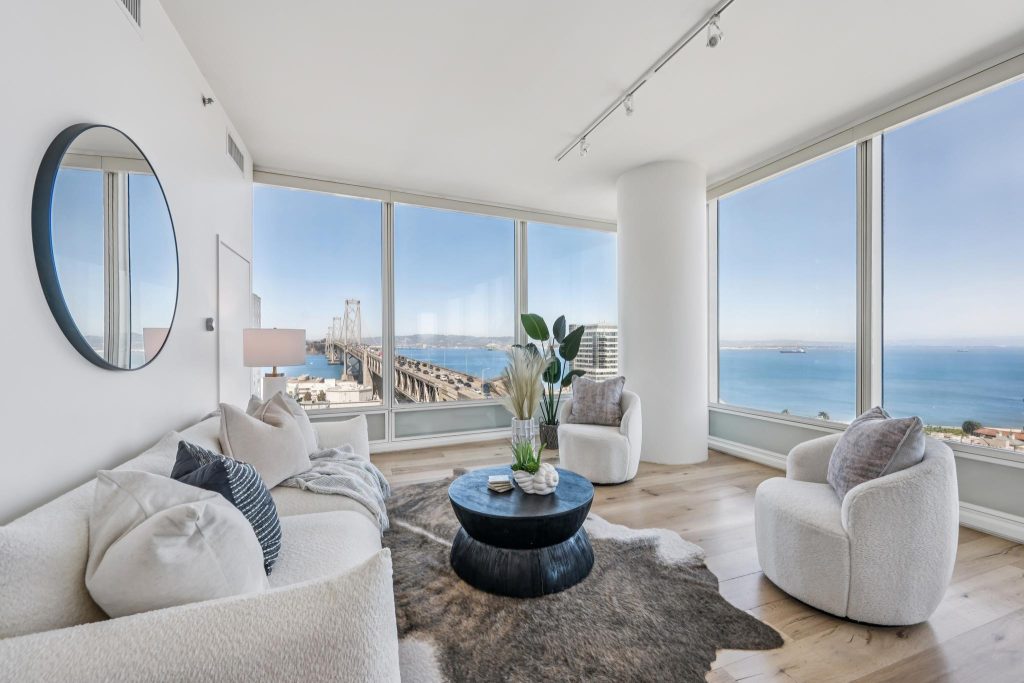 Rincon Hill East Cut luxury highrise condo living room with views of the Bay Bridge San Francisco