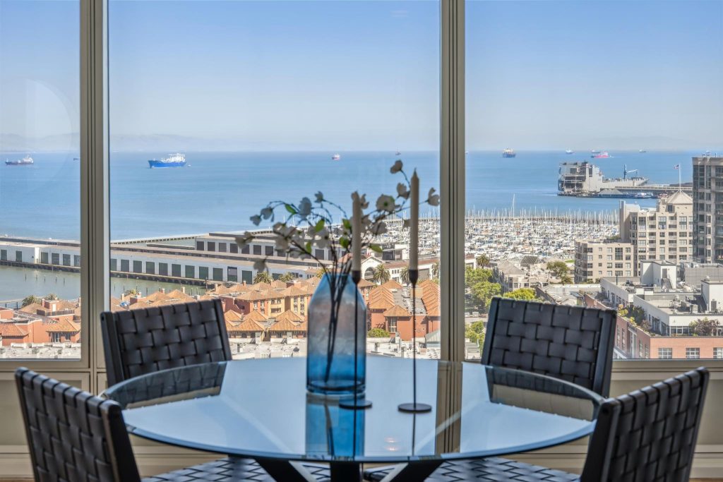 Dining area with SF Bay views in East Cut luxury condo for sale by top local real estate agent team SFHIGHRISES by Robyn Kaufman
