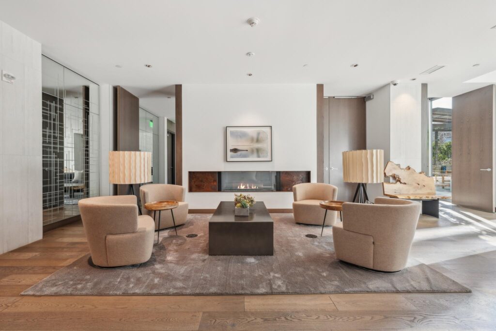 Common area lounge with fireplace at One Mission Bay condo building