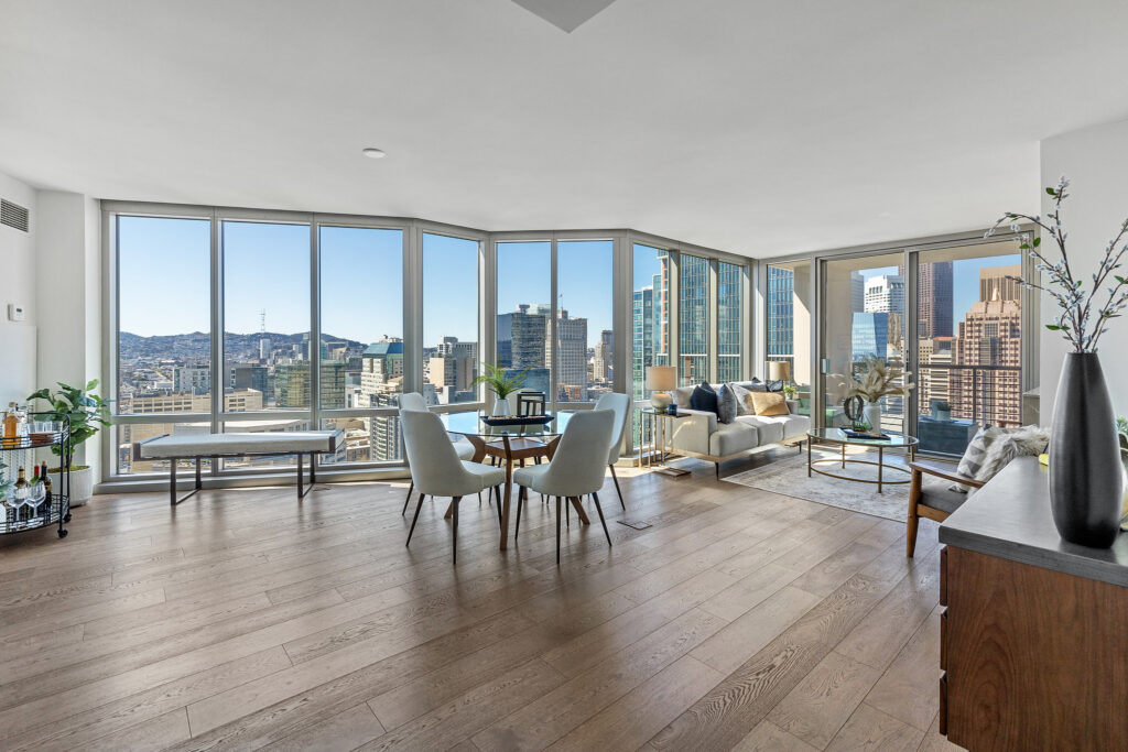 Open concept living room of luxury highrise condo in Mission Bay with views above SF downtown