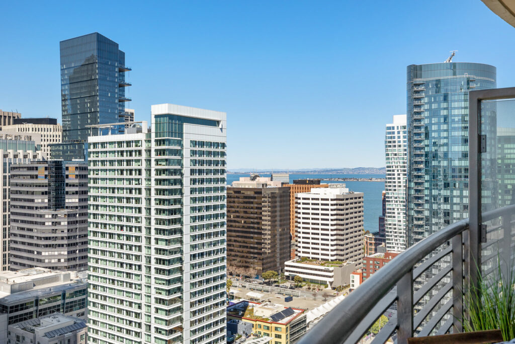 Balcony views of highrise condo buildings in San Francisco’s South Beach and downtown areas
