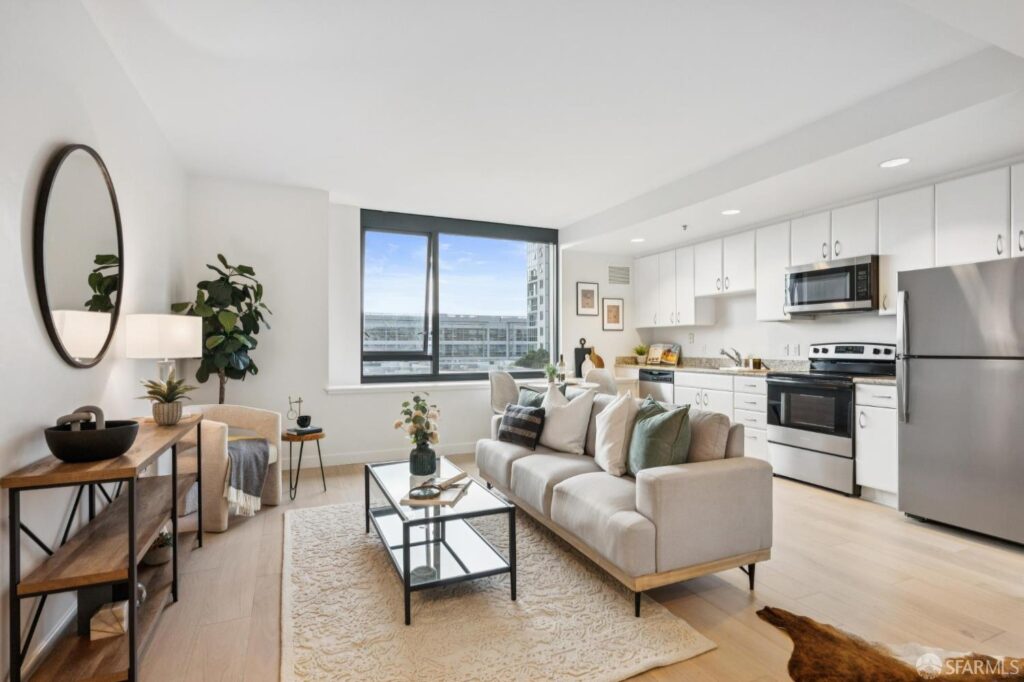 Open living room and kitchen of a San Francisco condo listing by the best local realtor agents Robyn Kaufman and SFHIGHRISES.com