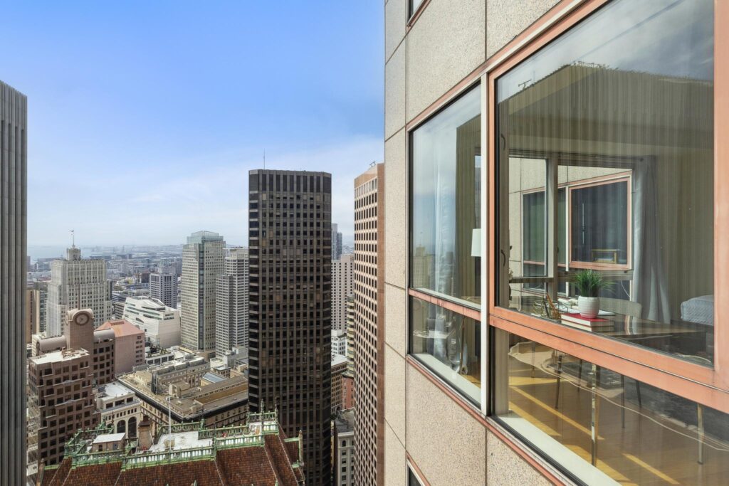 Drone photo outside an 18th floor condo unit showing the view of downtown SF and surrounding areas